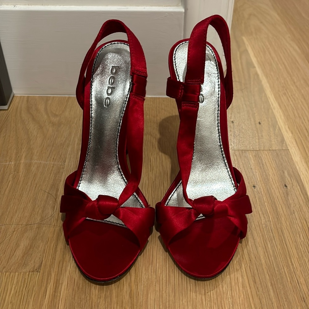 Excellent condition size 7 satin red sandals from Bebe.
